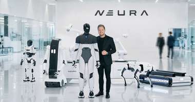 NEURA Robotics CEO David Reger with the company's robot lineup, including the 4NE-1 humanoid (Photo: NEURA Robotics)