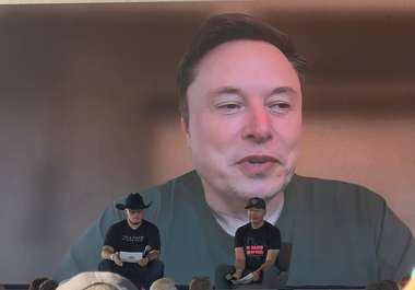 Elon Musk appearing on the main stage screen during his virtual interview at X Takeover at Giga Texas (Image: TeslaNorth)