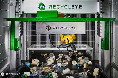 A Recycleye AI-powered robotic arm sorts recyclables at a waste facility (Photo: Recycleye)
